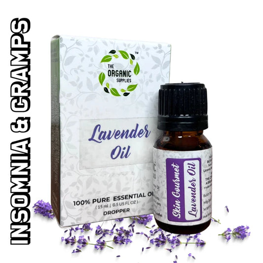 A 10ml dropper bottle of lavender essential oil sits upright on a white surface, near a cardboard box of dried lavender flowers.