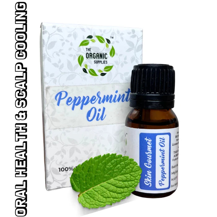 Realistic image of a glass bottle Of peppermint oil along with its packaging box and some fresh mint and the label that reads "ORAL HEALTH & SCALP COOLING" from the brand The organic supplies. 
